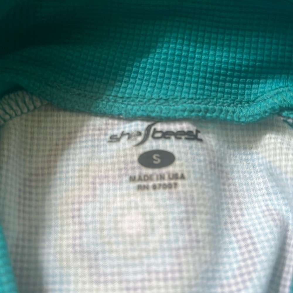 She beast size small two pocket half zip cycle jersey long sleeve